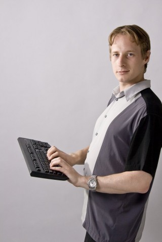 Michael Kubler holding a magic hovering keyboard